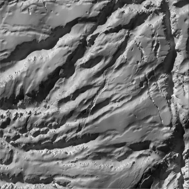 Photograph of Enceladus, a moon of Saturn.