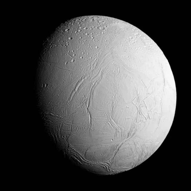 Photograph of Enceladus, a moon of Saturn.