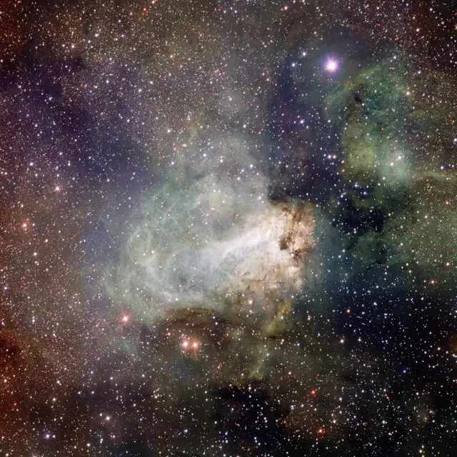 Photograph of Checkmark Nebula, a nebula in Sagittarius.