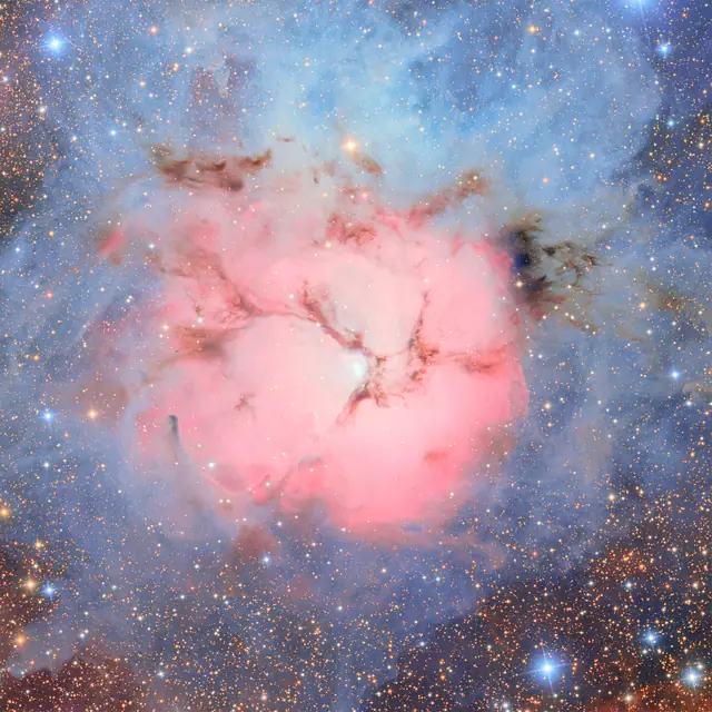 Photograph of Trifid Nebula, a nebula in Sagittarius.