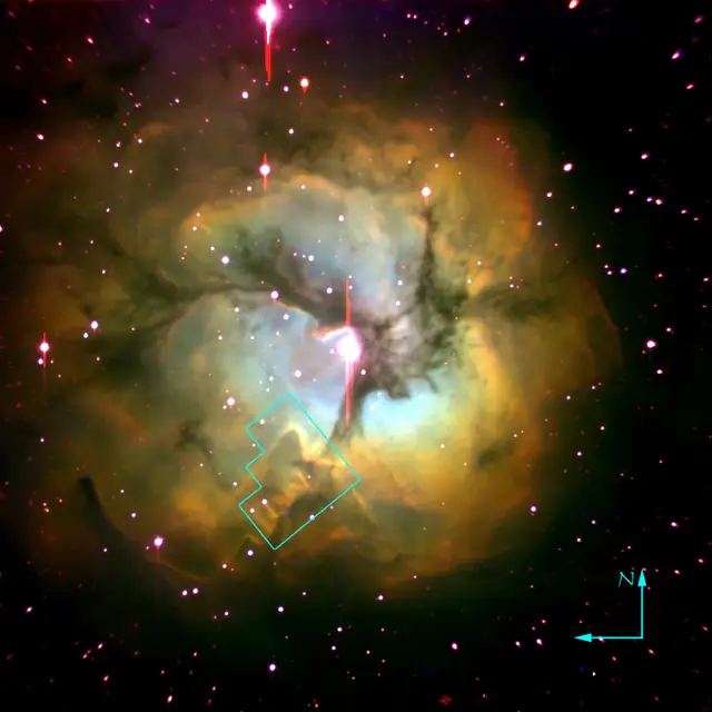 Photograph of Trifid Nebula, a nebula in Sagittarius.