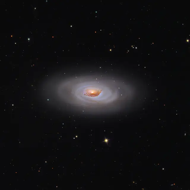 Photograph of Black Eye Galaxy, an intermediate spiral galaxy SABa in Coma Berenices.