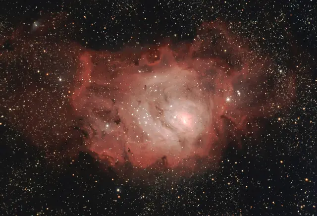 Photograph of Lagoon Nebula, a nebula in Sagittarius.