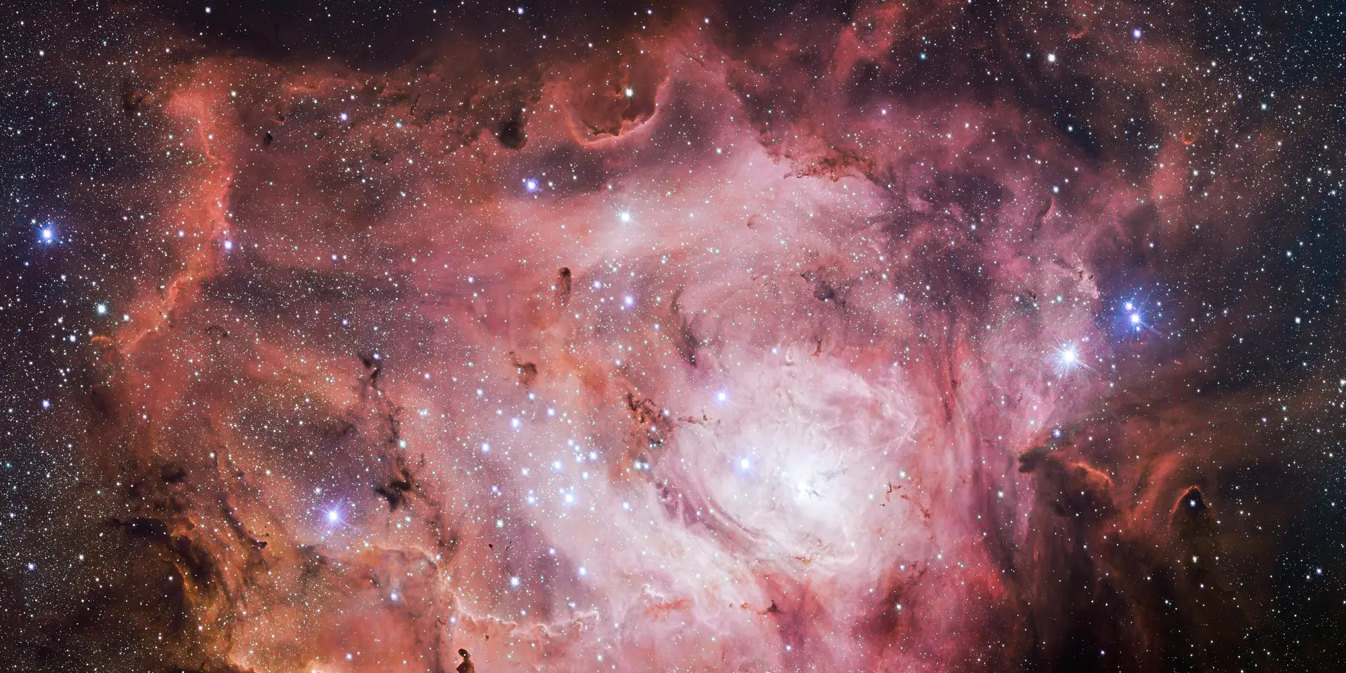 Photograph of Lagoon Nebula, a nebula in Sagittarius.