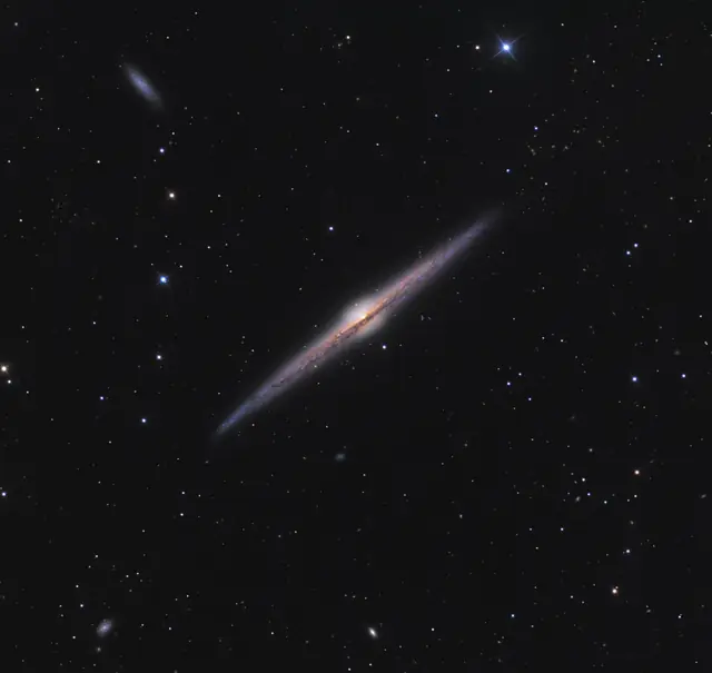 Photograph of Needle Galaxy, a spiral galaxy Sb in Coma Berenices.
