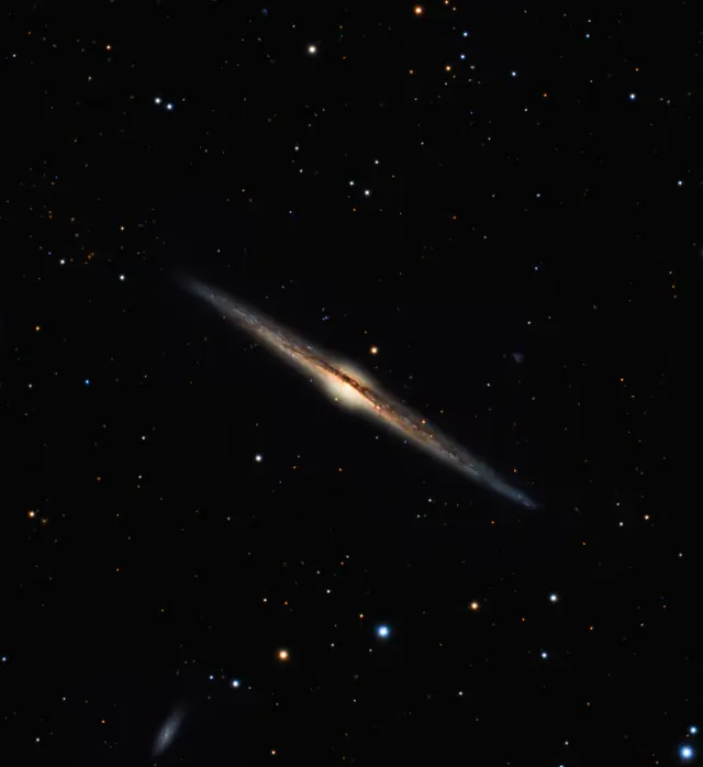 Photograph of Needle Galaxy, a spiral galaxy Sb in Coma Berenices.