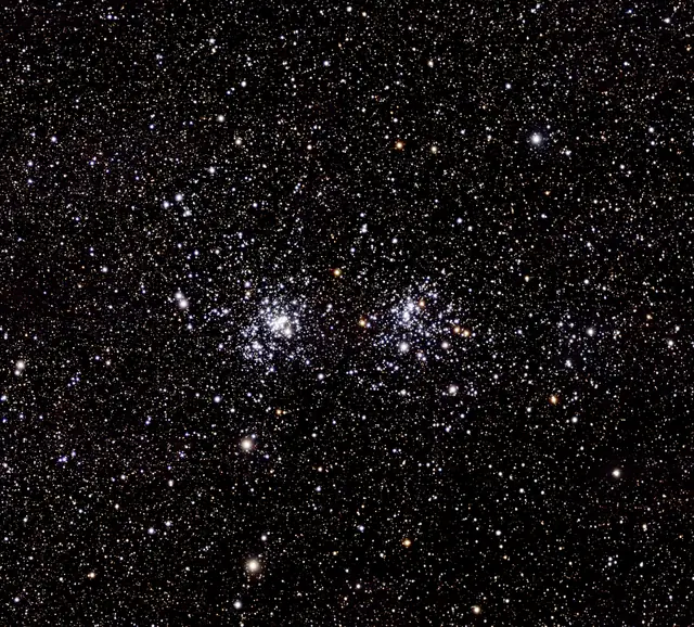 Photograph of h Persei Cluster, an open cluster in Perseus.