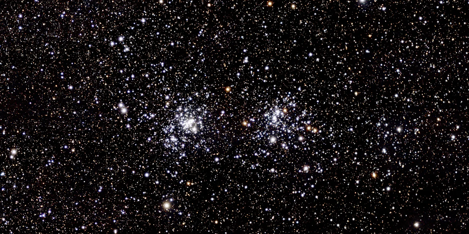 Photograph of h Persei Cluster, an open cluster in Perseus.