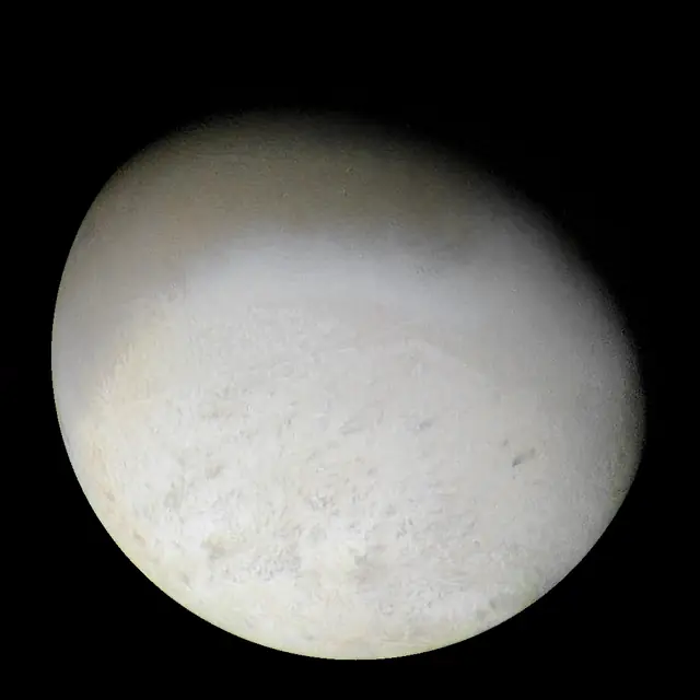Photograph of Triton, a moon of Neptune.